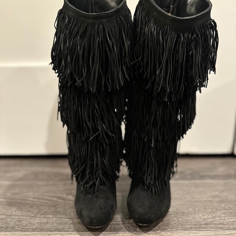 Christian louboutin classic vintage fringe boots.